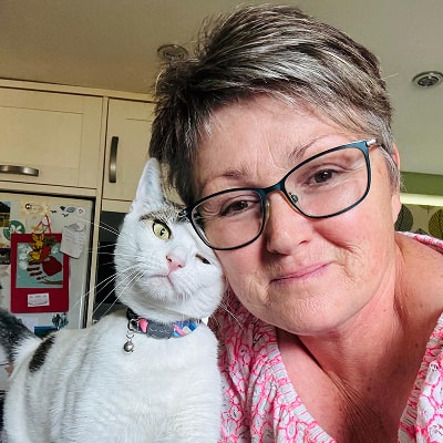 Kim and a cat Guinea pig